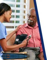 caregiver checking patient's blood pressure