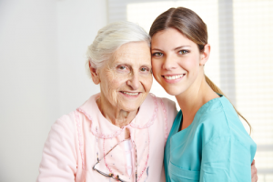 caregiver and old woman smiling