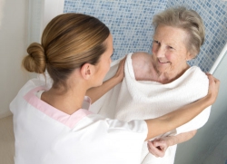 caregiver giving patient a bath